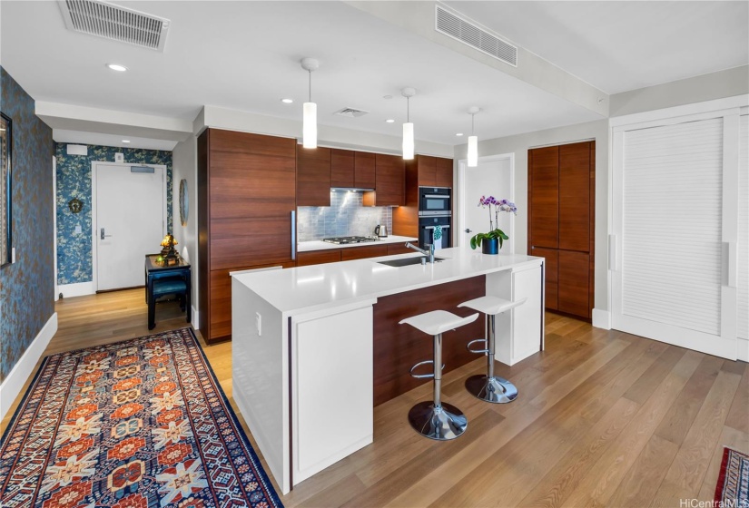 Gas stove in the kitchen, oversized island counter