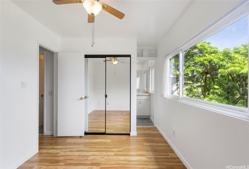 Primary Bedroom view of closet area and ensuite bathroom