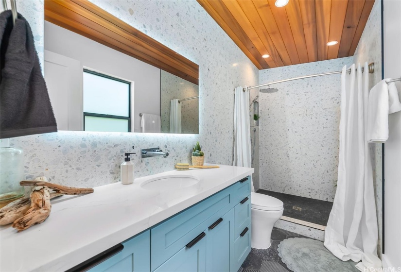 Primary bathroom - tiled walls w/ beautiful cedar ceilings