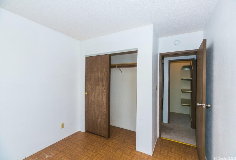 1st bedroom looking into the large walkin closet