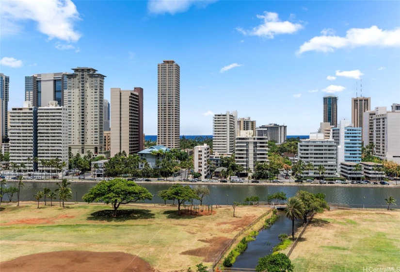 Enjoy picturesque views of the Ala Wai Canal framed by lush greenery and the Honolulu cityscape.