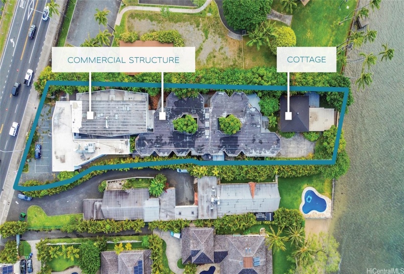 Aerial view of property showing commercial structure and cottage