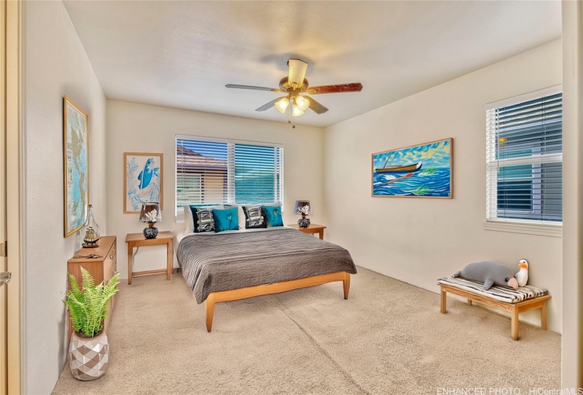 Primary Bedroom off of second floor landing. Virtually staged & enhanced.