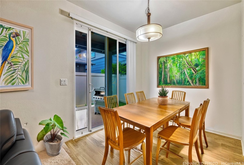 Dining area off of outdoor lanai. Virtually staged & enhanced.