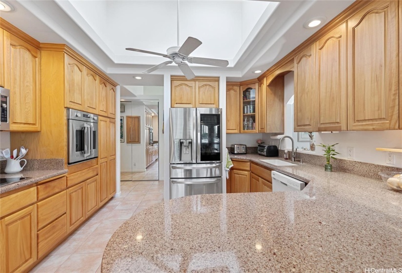 renovated kitchen with lots of cabinets and quartz counter tops!