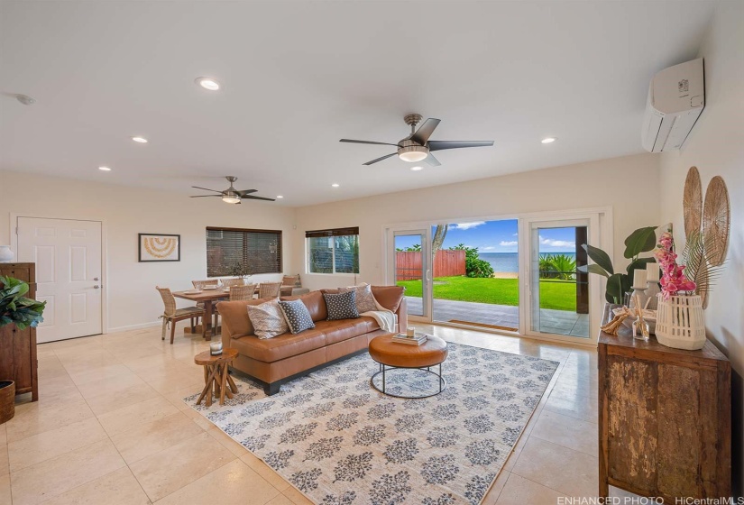 Downstairs Living Area Open To Covered Lanai And Yard...Enhanced Photo