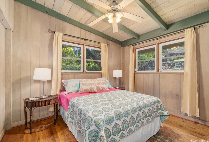 Second bedroom at the other end of the upper level also enjoys the same hardwood floors, light and ventilation, and large closet space.