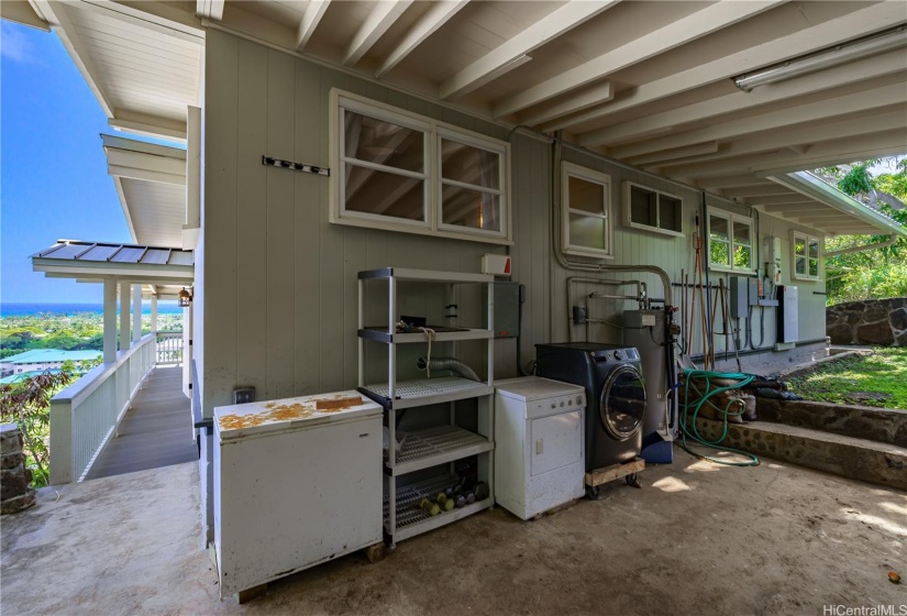 Even with some of the appliances located on the back lanai, there's still plenty of room for outdoor dining in this secluded and private space.