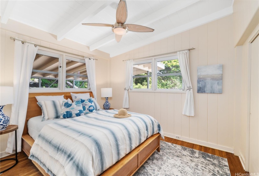 Primary bedroom with beautiful hardwood floors, lots of light and ventilation, and a large closet.