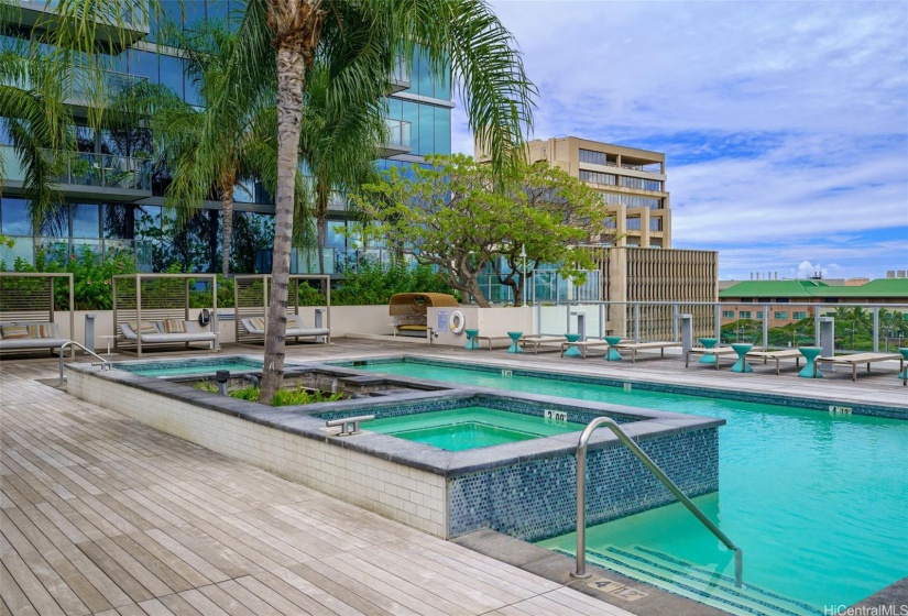 The pool area is well appointed with poolside cabanas and lounge chairs!