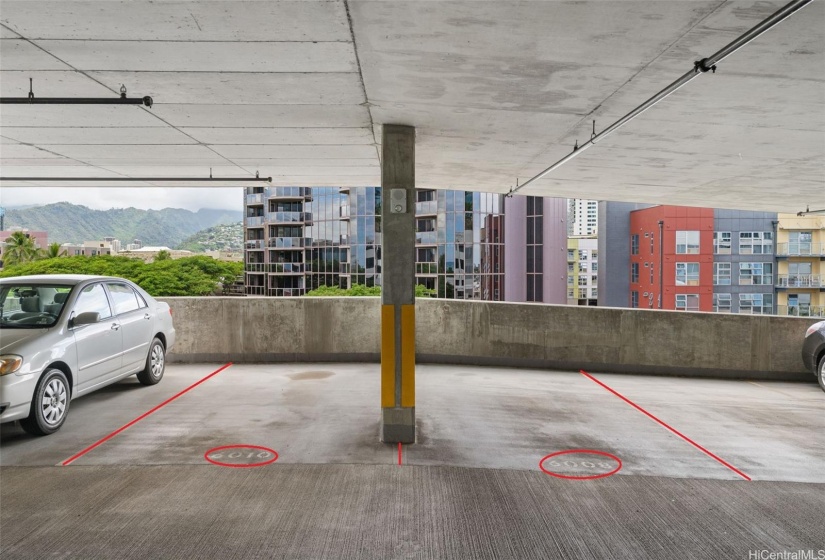 Two full size side-by-side parking stalls, 6008 and 6010, are located on the fifth floor of the parking structure.