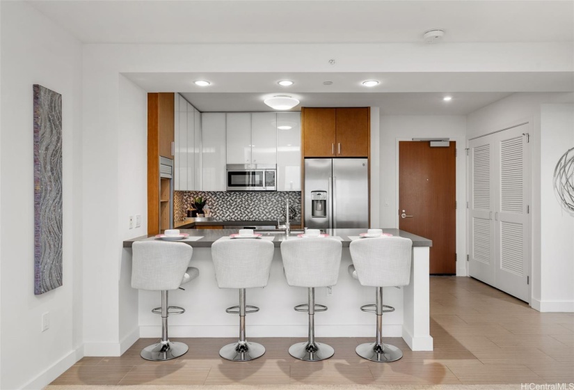 Kitchen counter accommodates four so no dining set needed.