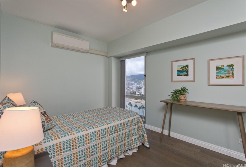 One of two bedrooms offering views, split a/c, and calm hues