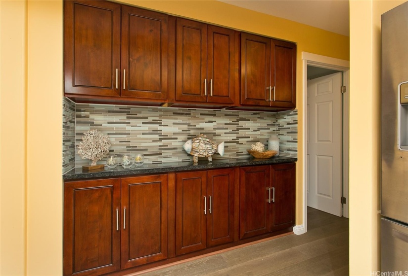 Additional cabinets and counter space offers many possibilties... possibly a bar, coffee station, or a showcase for your favorite treasures. It's here awaiting your personal touches.