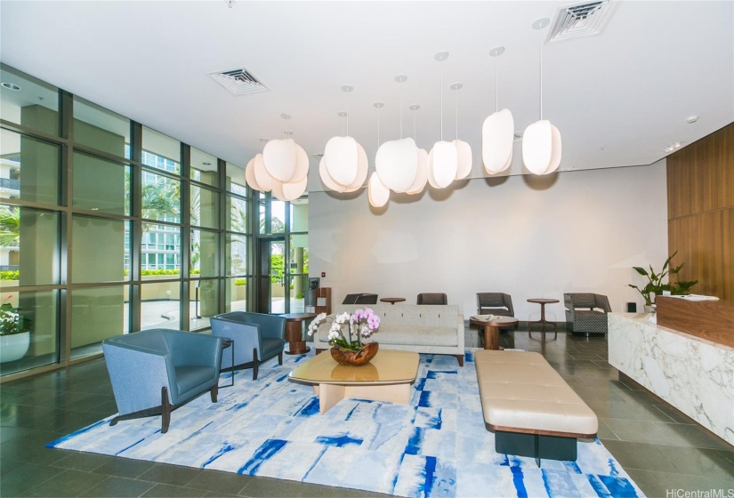 The modern lobby features dark stone, dark wood, brushed steel and Hawaiian art. A state of the art 24 hour security guard station is located in the lobby near the mail room. Five high speed elevators are used to access the 394 units