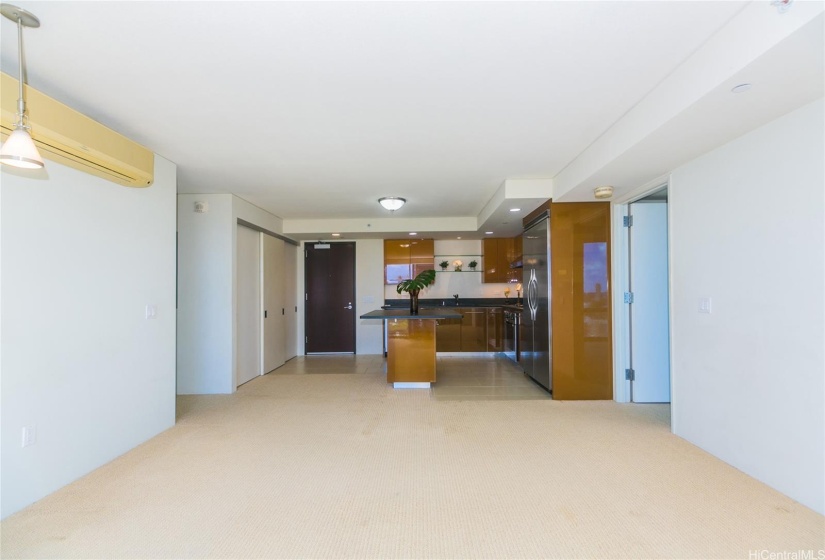 Open entryway to the kitchen and living spaces - with extra privacy for bedrooms on opposite sides.