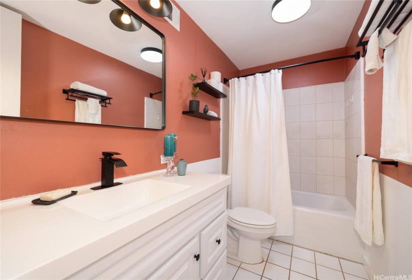 BATHROOM WITH UPGRADED FIXTURES.