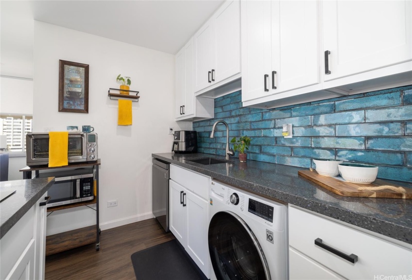 UPGRADED WOODEN CABINETRY WITH PULLOUTS INSIDE OF CABINETS AND PULLOUT SPICE RACK.