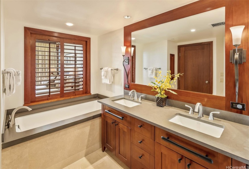 Primary bathroom ensuite complete with large soaking tub, dual sinks