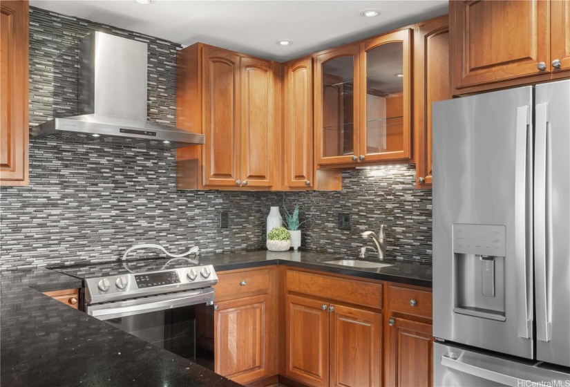 Spacious kitchen with stainless appliances.