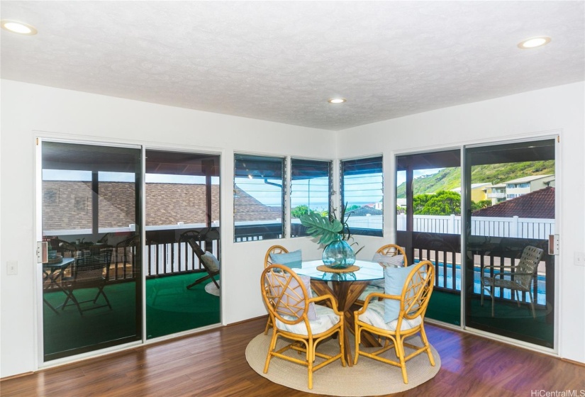 Enjoy your family room while viewing the pool.