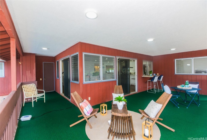 Spacious L-shaped lanai off the kitchen for easy access.