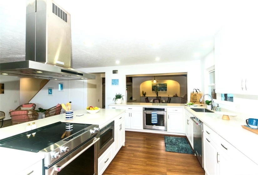 Gourmet kitchen equipped with 2 ovens for creating amazing meals. Open to dining room.