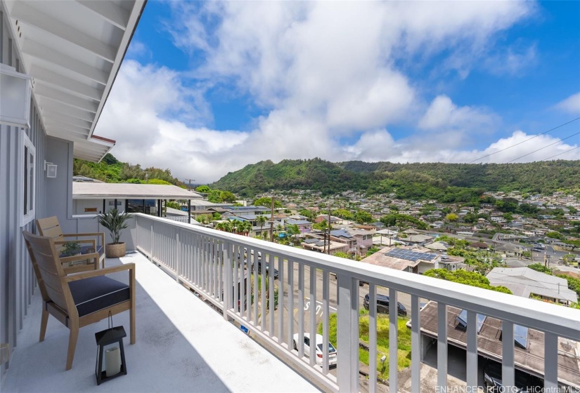 Enhanced. Upper 4BR/2.5BA level lanai with view toward verdant Kalihi Valley.