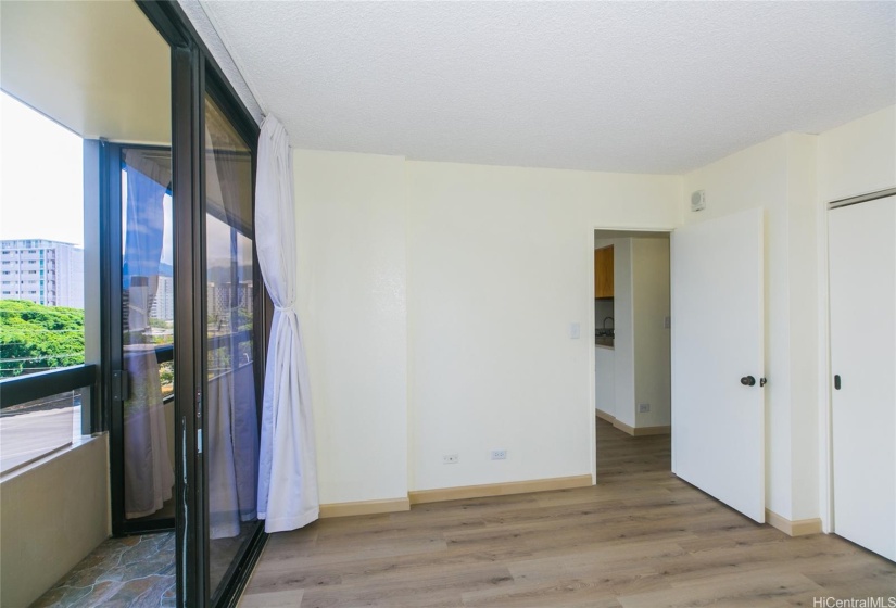 The bedroom sliders open onto a newly-tiled lanai