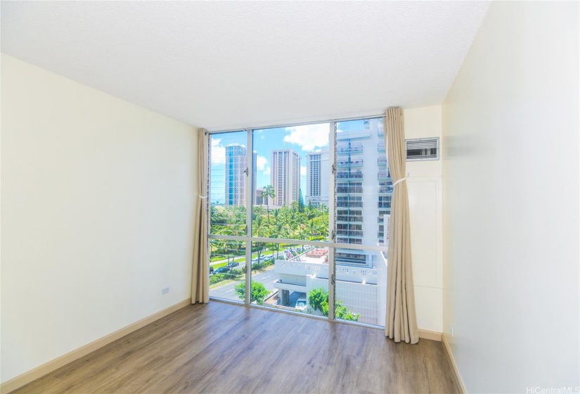 Such a pretty bedroom with floor-to ceiling sliders