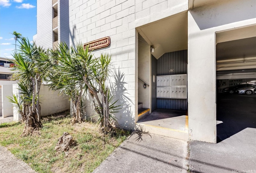 Main stairway leading up to the property. Located straight away is the mailbox area.