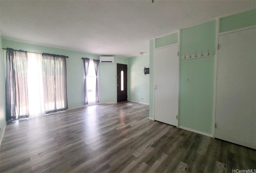 Huge livinf room with split AC & laminate floors.