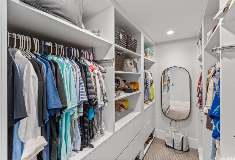 Your primary bedroom includes this walk in closet for two.