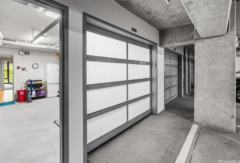 AMAZING Feature. ATTACHED PRIVATE GARAGE as you walk down staircase to this level. One vehicle can fit here, and then a tandem stall sits in front of the secured auto garage door for 2nd vehicle (which is part of the total residents garage in building.)