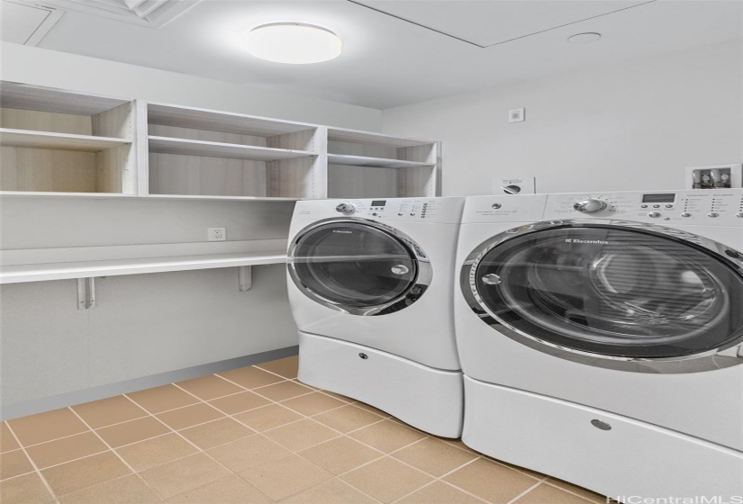 Full Laundry room offers side by side washer-dryer, storage shelving and even a washing sink. (not shown in photo).