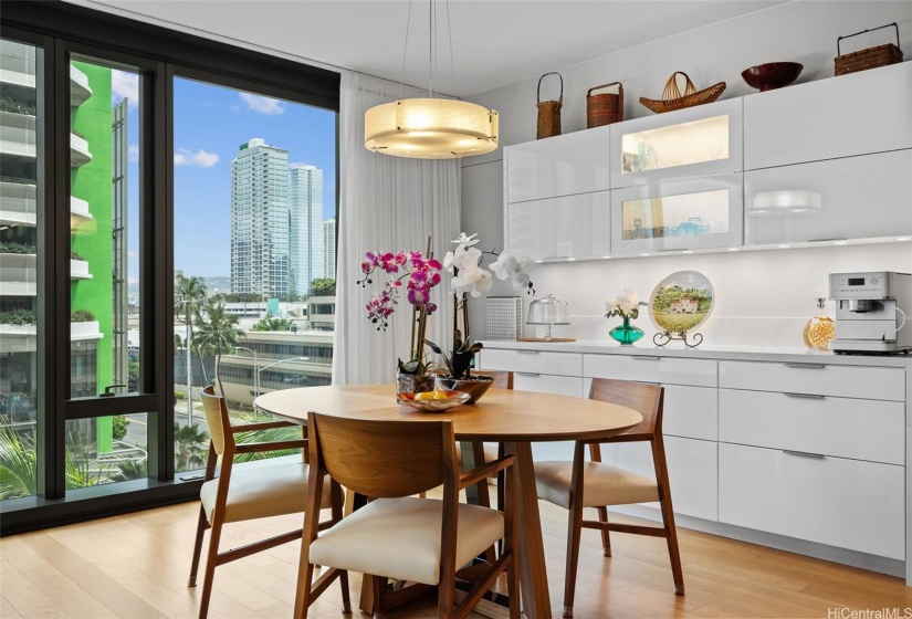 Splendid built-in of a customized sideboard-hutch, in modern white lacquer finish. A view of the city while you entertain here.