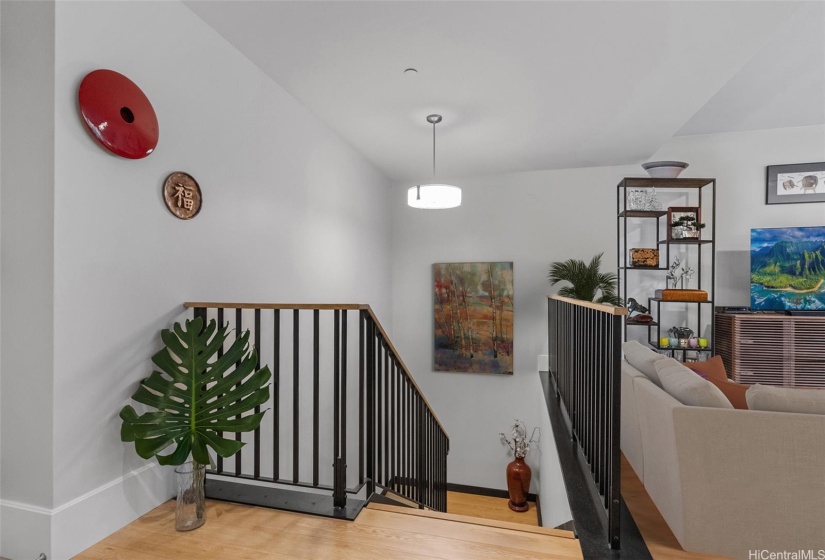 Living area, kitchen, dining area and half bath occupy the top level. Staircase down leads to your two bedrooms, bathrooms and laundry area. Access your attached private garage from this bottom level also! Amazing layout. Partial virtually staged.