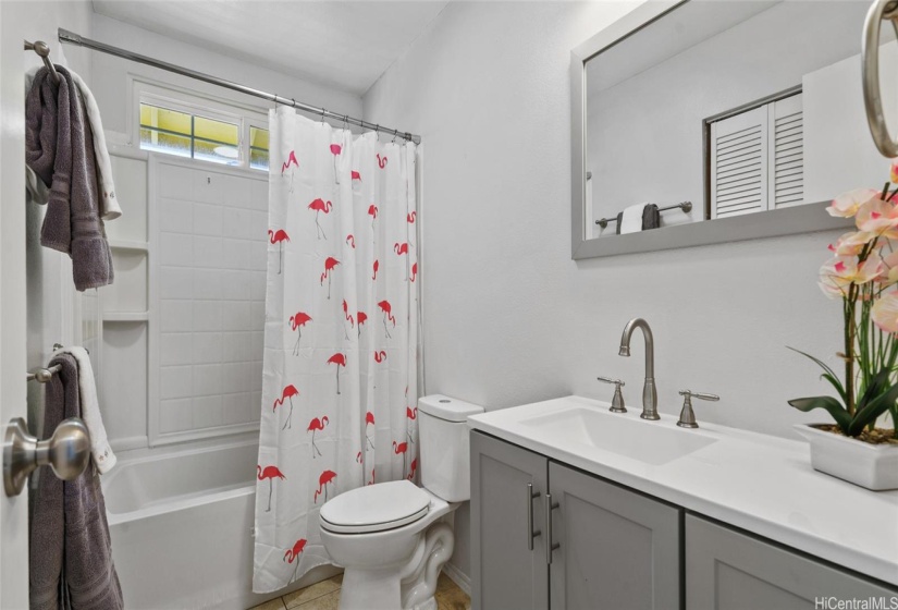 2nd bathroom with lots of storage and tub/shower combo