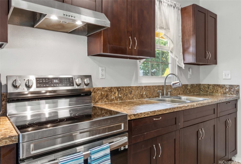 Open kitchen with stainless steel appliances