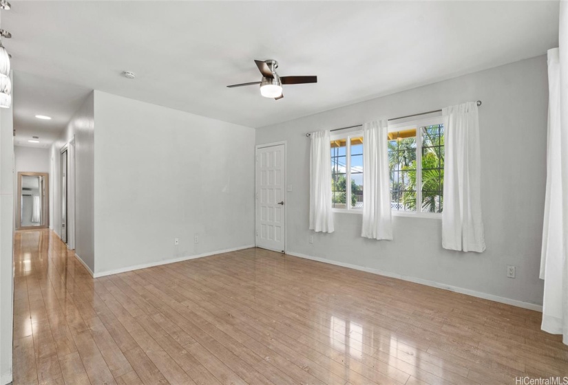 Large living room with split ac and lots of natural light