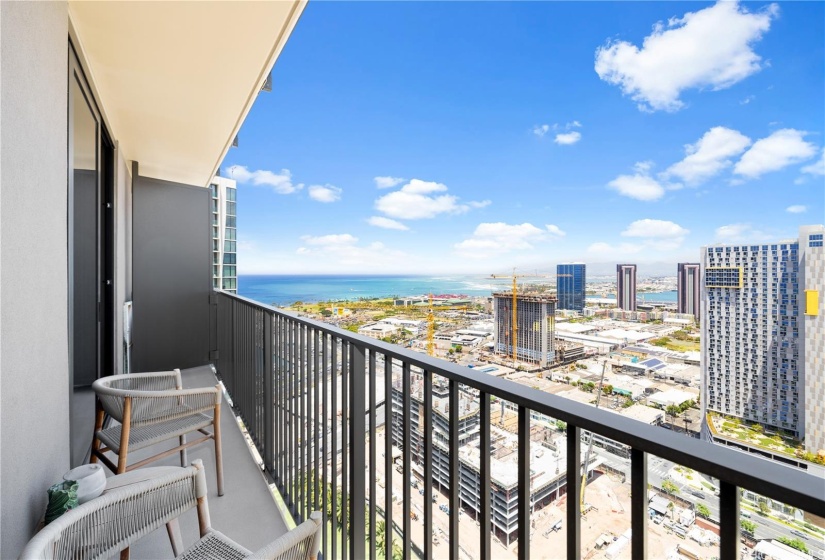 View from the lanai also includes 2 chairs and a small coffee table