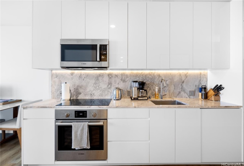 Ample storage allows for a clean look in kitchen space.