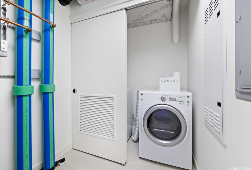 Large washer and dryer side-by-side inside the  laundry room