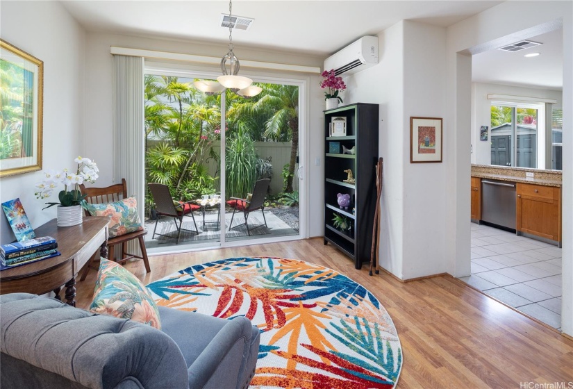 Cheerful living area, with  entry to garden.