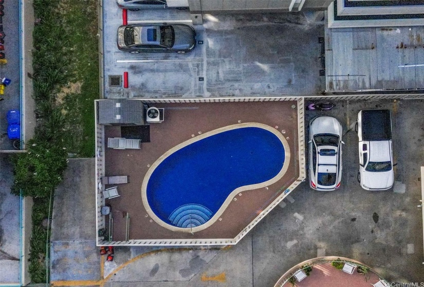 Community pool and unit parking stall adjacent to pool