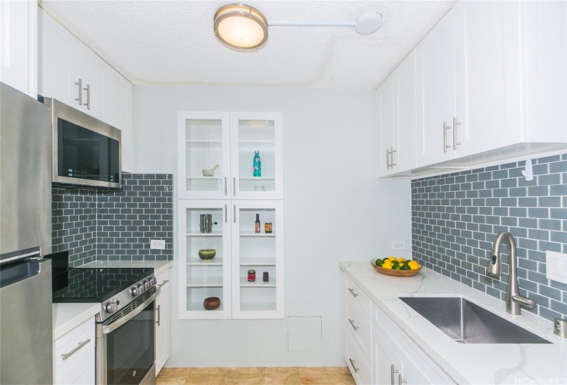 Kitchen was completely renovated in 2020. Only the charming built-in cabinet is original. The microwave hood is vented!