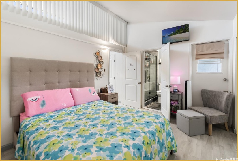 Spacious Upstairs Primary Bedroom showing the Primary Bathroom Entrance