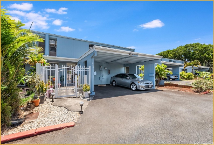 Front of the home Highlighting one of the Parking spots on the left