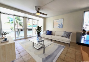 Living room has been virtually staged with furniture