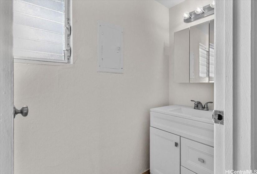 The downstairs bathroom is perfect for guests and privacy.